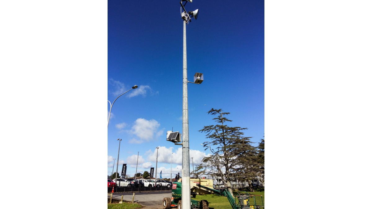 Public park with caged wind sensor to 